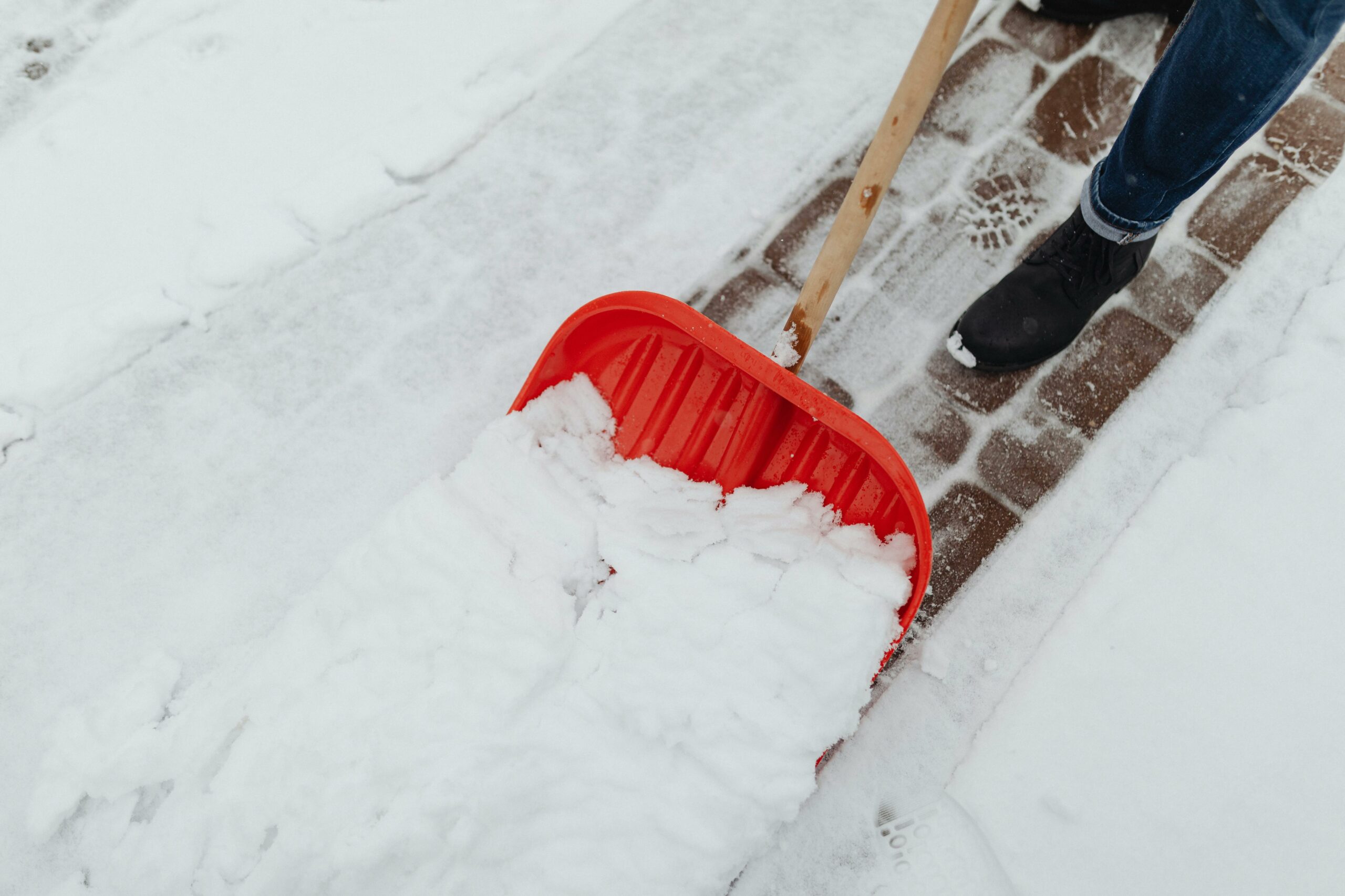 Shoveling snow on driveway